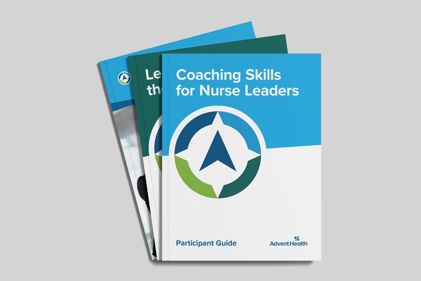 Stack of three AdventHealth Leadership Institute participant guide covers