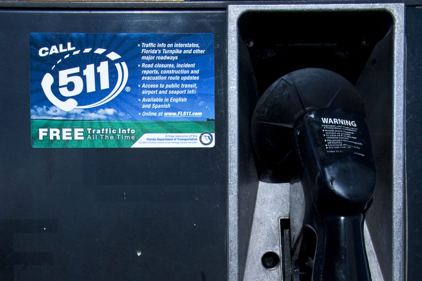Close-up of the Florida 511 fuel pump sticker beside the nozzle